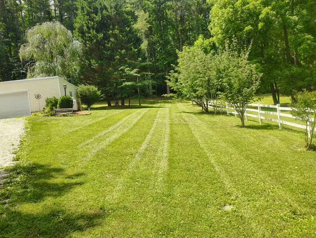 Mowed lawn with clean edges in Asheville NC